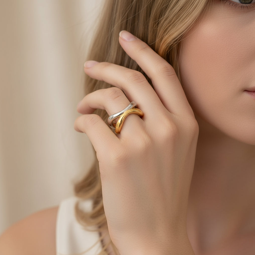Two-toned gold and silver ring on a white background