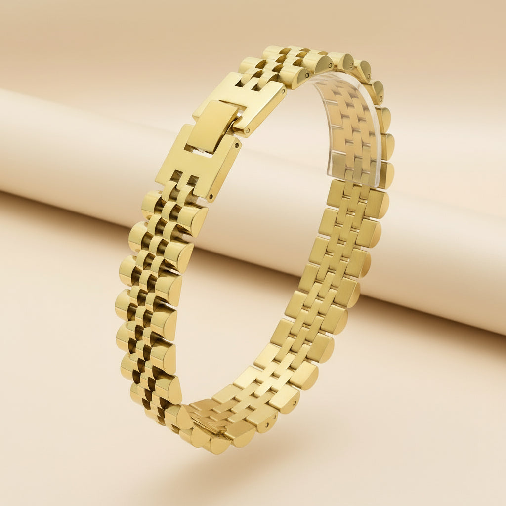 Gold metal bracelet on a white background with weight and dimensions displayed.