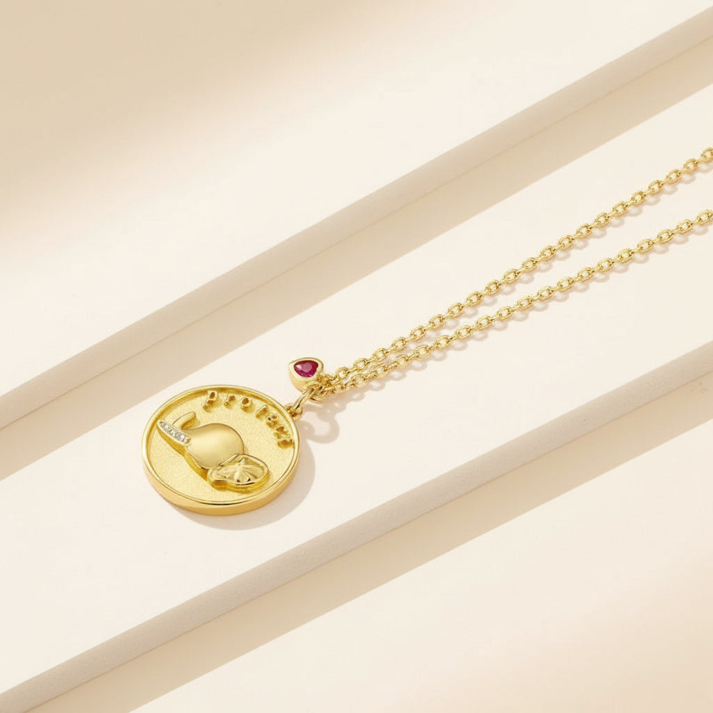 Gold-tone sterling silver elephant medallion necklace