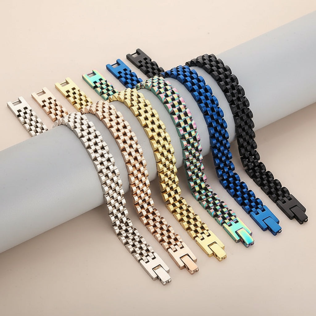 Set of colorful metal bracelets on a light gray background