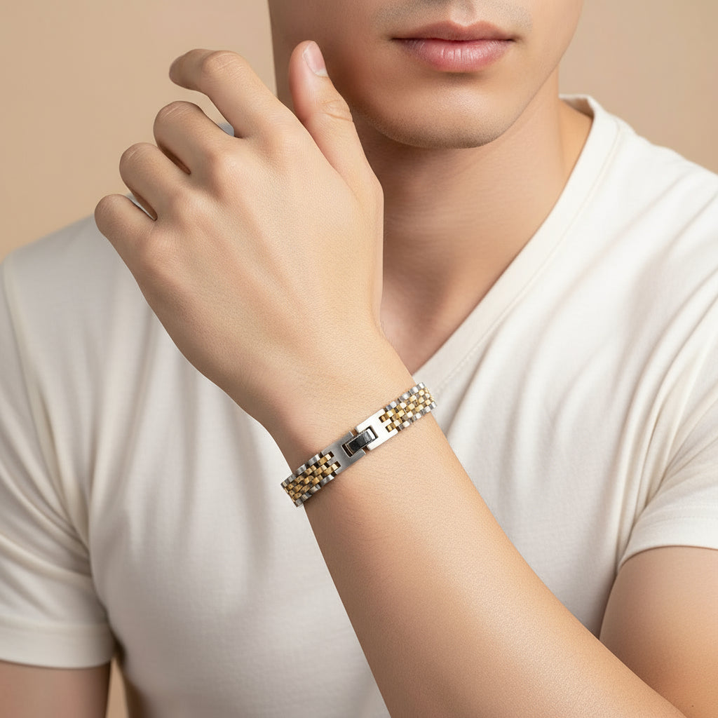 Two-tone metal bracelet with interlocking design on a beige background