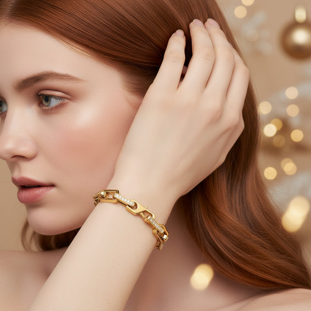 Gold bracelet with diamond accents on a white background